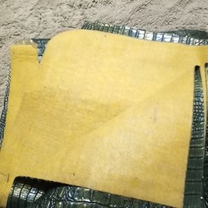 Faux alligator material green with gold iridescent